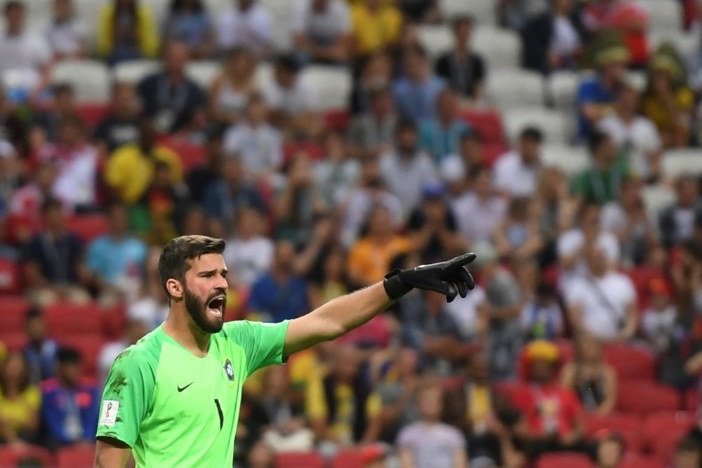 Alisson and Firmino are now team-mates for club and country. AFP