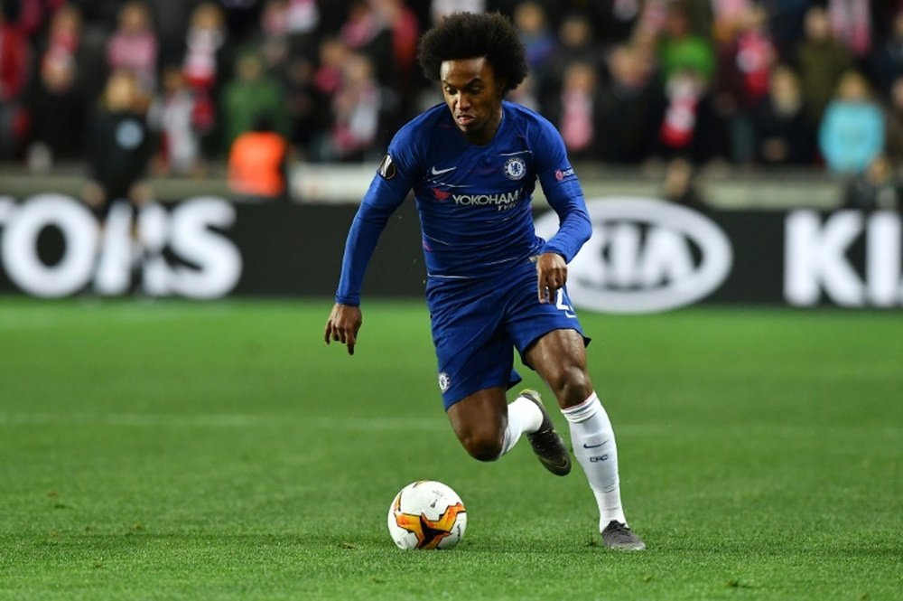 Willian will extend his Chelsea contract by one season instead of leaving. AFP