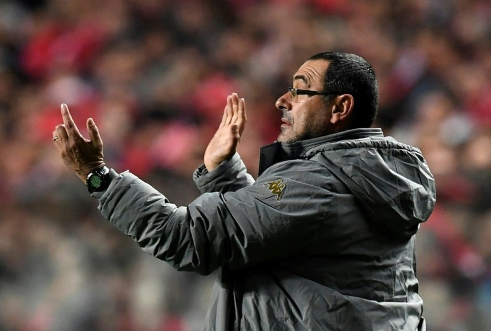 Napolis coach Maurizio Sarri gestures from the sideline during the UEFA Champions League Group B football match SL Benfica vs SSC Napoli at the Luz stadium in Lisbon, on December 6, 2016