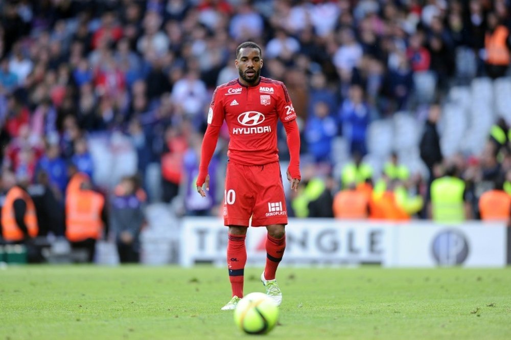Lyons French forward Alexandre Lacazette eyes the ball. BeSoccer