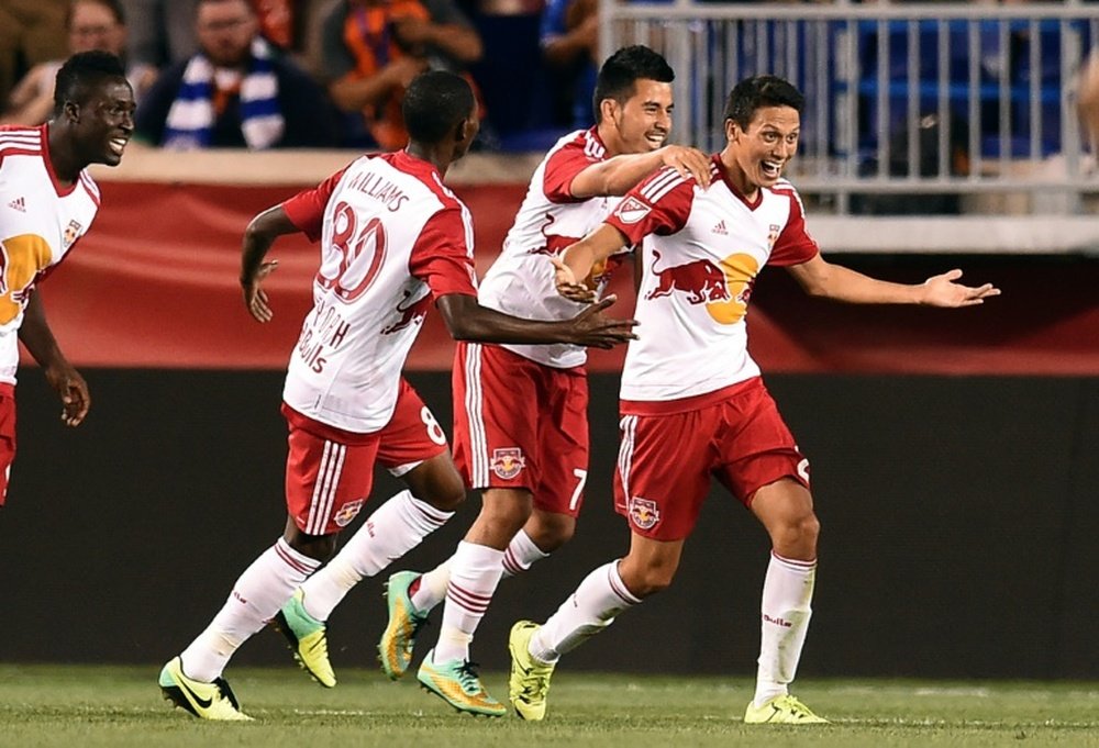 New York Red Bulls midfielder Sean Davis (R) celebrates with teammates after scoring against Chelsea during their International Champions Cup match at the Red Bull Arena in Harrison on July 22, 2015