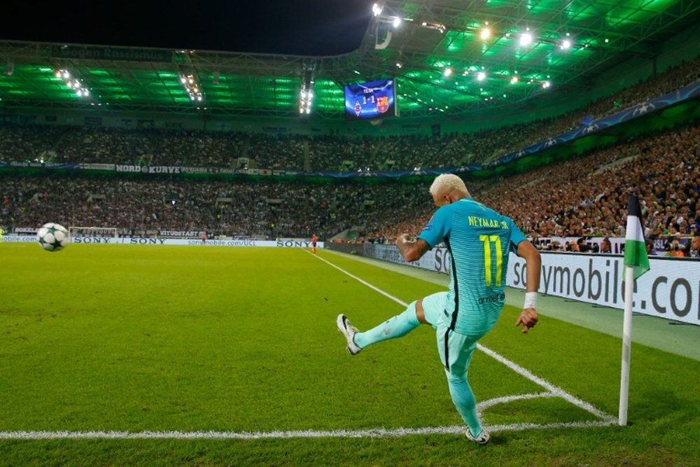 Barcelonas Neymar takes a corner during their UEFA Champions League Group C match against Borussia Gladbach, at the Borussia Park in Moenchengladbach, on September 28, 2016