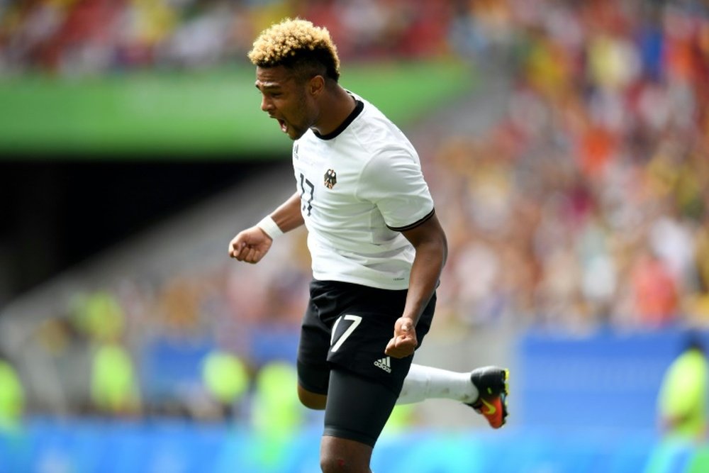 Germany s players Serge Gnabry celebrates after he score during the Rio 2016 Olympic Games Quarter-finals mens football match Portugal vs Germany, at the Mane Garrincha Stadium in Brasilia on August 13, 2016