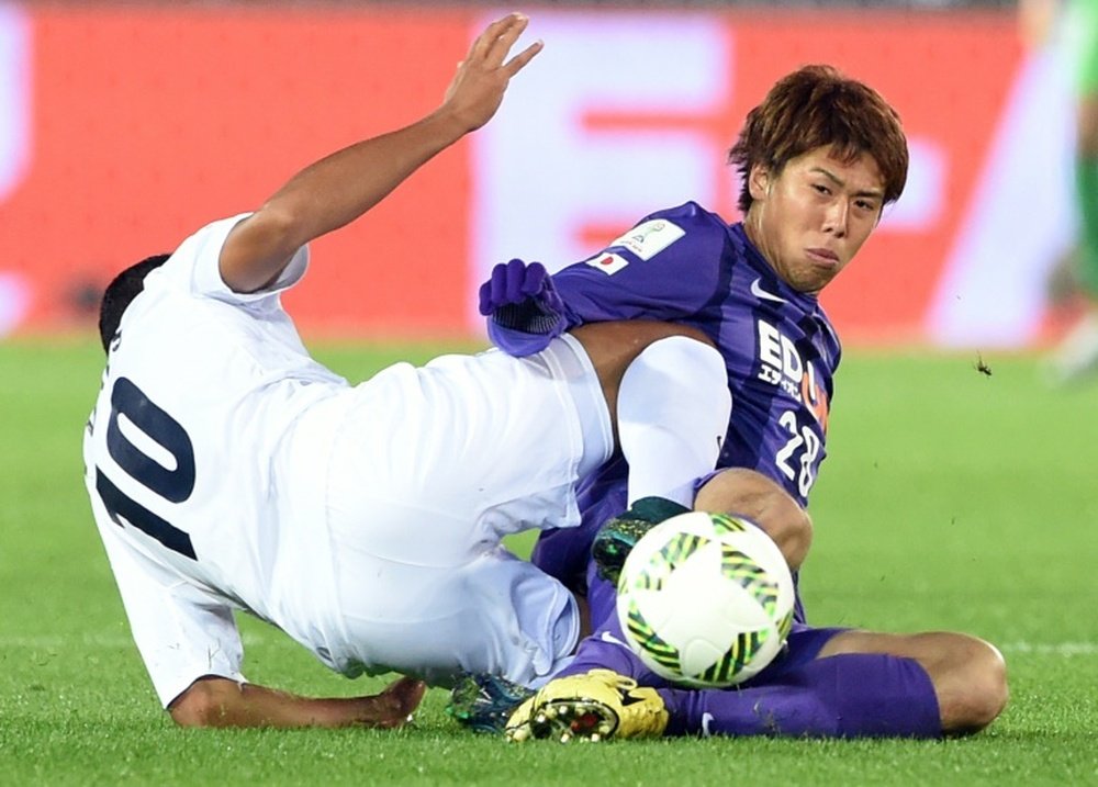 Sanfrecce Hiroshimas Takuya Marutani (right) battles for the ball with Auckland City forward Ryan de Vries during their FIFA Club World Cup match in Yokohama, Japan, on December 10, 2015