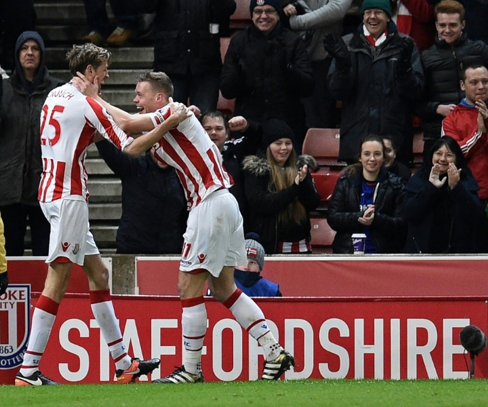 Stoke City's Peter Crouch (L) celebrates with teammate Ryan Shawcross after scoring their second goal against Watford in Stoke-on-Trent, central England on January 3, 2017