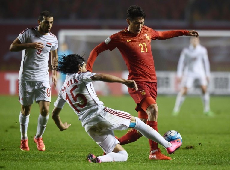 China football chief consoles players after shock Syria upset