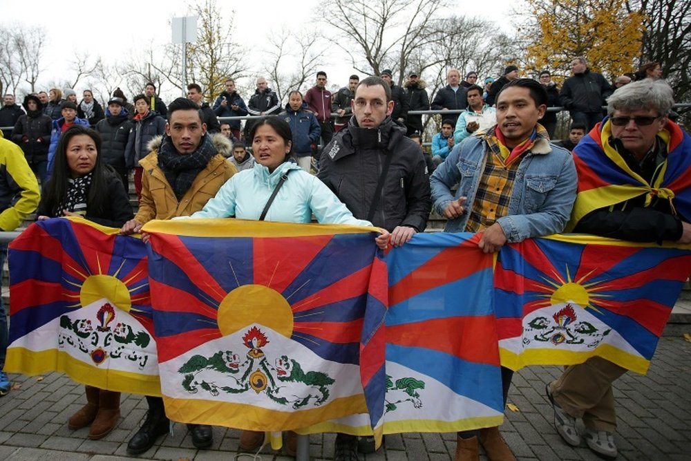 Protesters with the Tibetan flag. AFP
