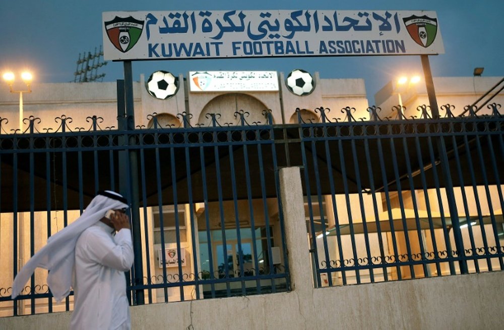 A man walks past the Kuwaiti Football Association (KFA)s headquarters on October 17, 2015, in Kuwait City
