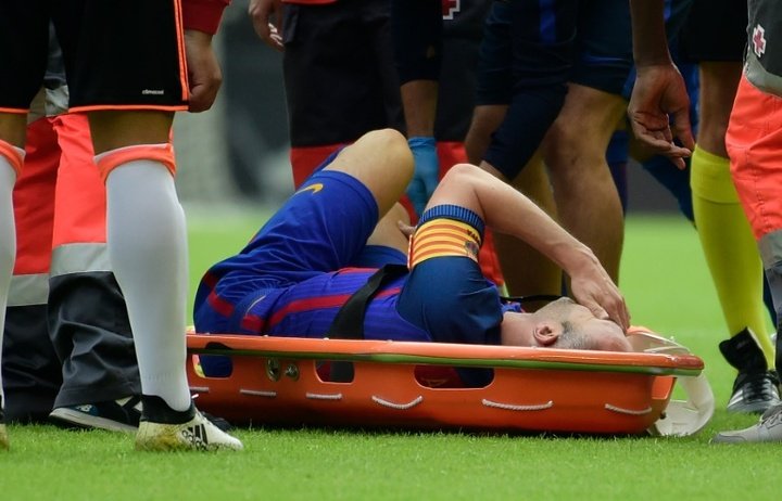 Tearful Iniesta suffers knee ligament damage