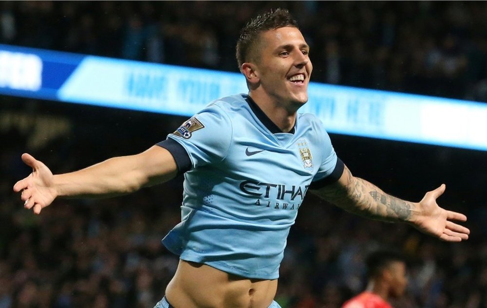 Manchester Citys Montenegrin striker Stevan Jovetic celebrates scoring a goal during the English Premier League football match between Manchester City and Liverpool in Manchester, England on August 25, 2014