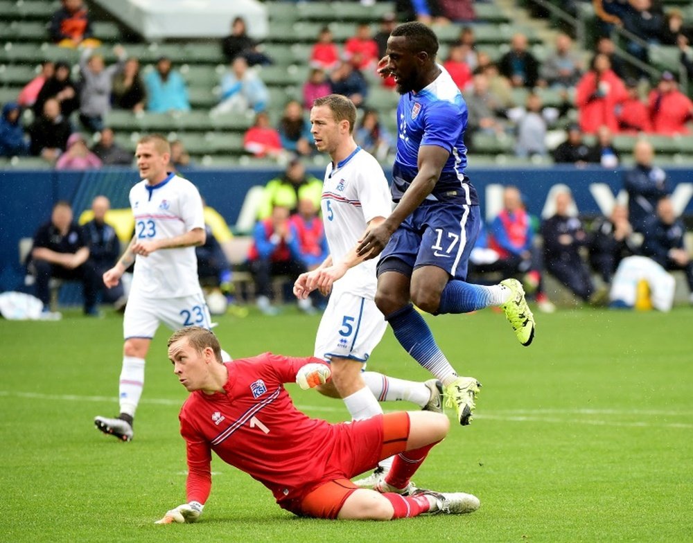 Jozy Altidore of the US scores a goal to tie the game 1-1 as Ogmundur Kristinsson of Iceland looks back during the first half at StubHub Center on January 31, 2016 in Carson, California