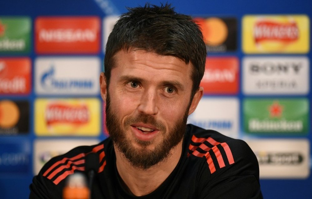 Carrick will stay on at United as a coach. AFP