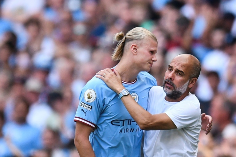 Haaland with Guardiola. AFP