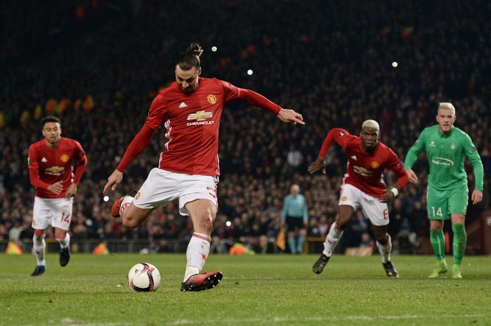 Manchester Uniteds striker Zlatan Ibrahimovic shoots from the penalty spot