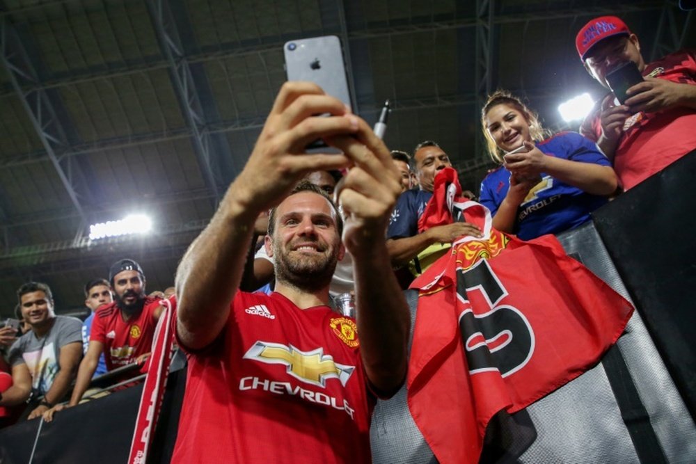 Juan Mata of Manchester United takes photos with fans after their International Champions Cup game against the Club America, at the University of Phoenix Stadium in Glendale, Arizona, on July 19, 2018