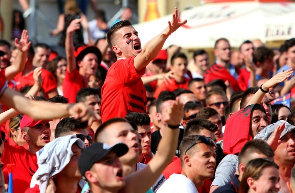 An Albania supporter reacts in Tiranas main boulevard fan zone on June 11, 2016