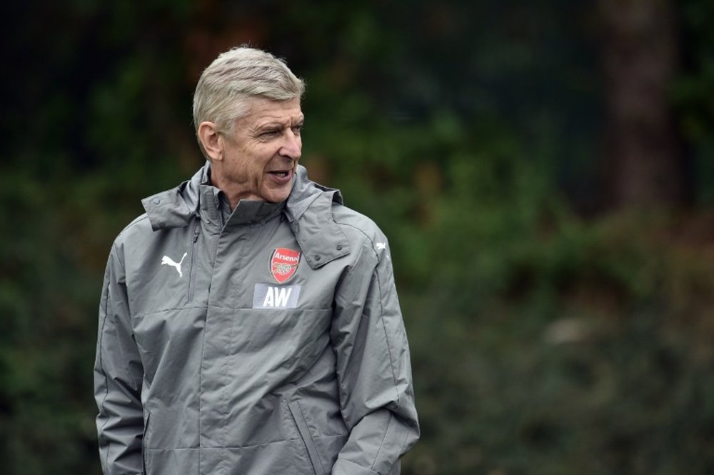 Arsene Wenger attends a training session with his team ahead of their match against Basel. AFP