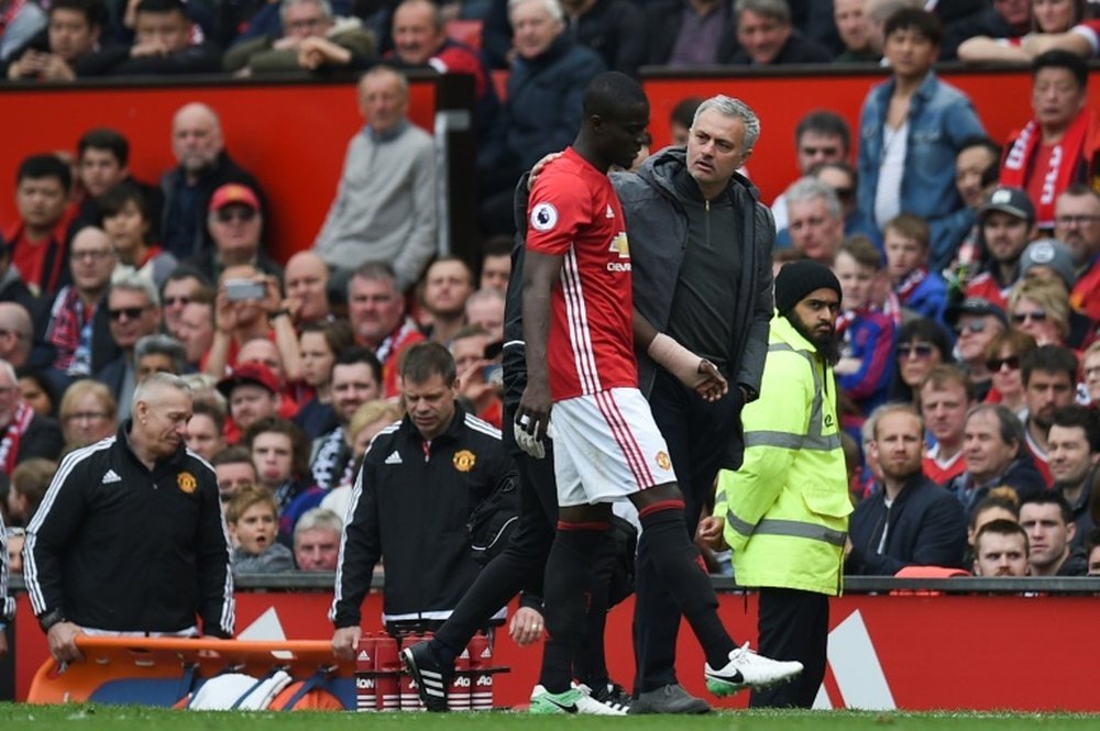 Roma have their eyes on Eric Bailly (L). AFP
