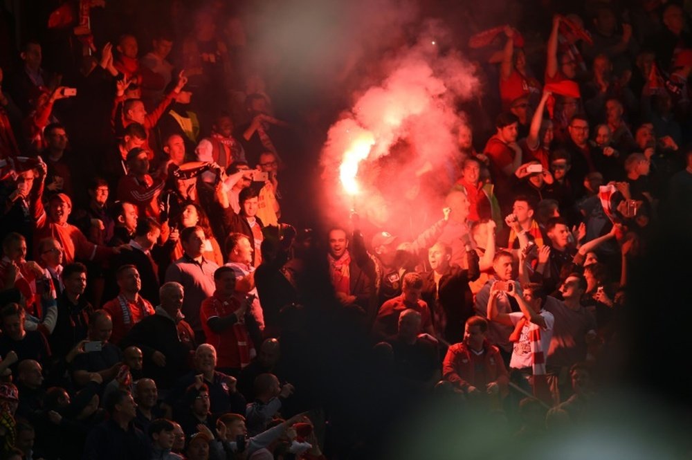 Liverpools supporters celebrate after their team opened scoring during the UEFA Europa League final football match against Sevilla FC at the St Jakob-Park stadium in Basel, on May 18, 2016