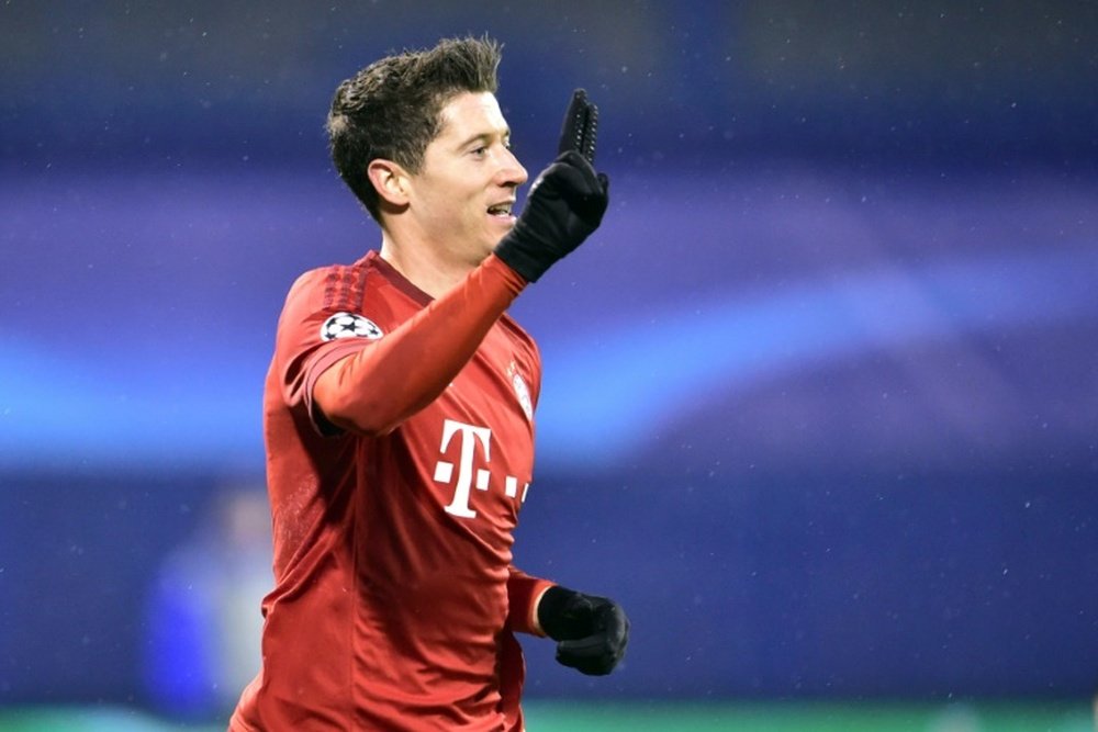 Bayern Munichs striker Robert Lewandowski celebrates scoring on December 9, 2015