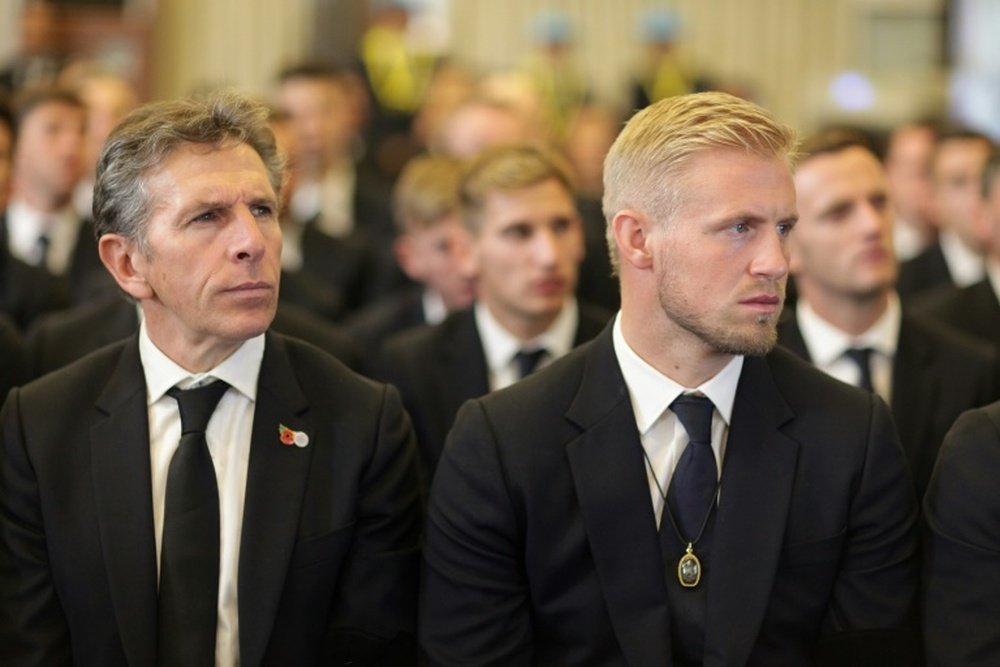 Schmeichel and Puel pictured at the funeral in Thailand. AFP