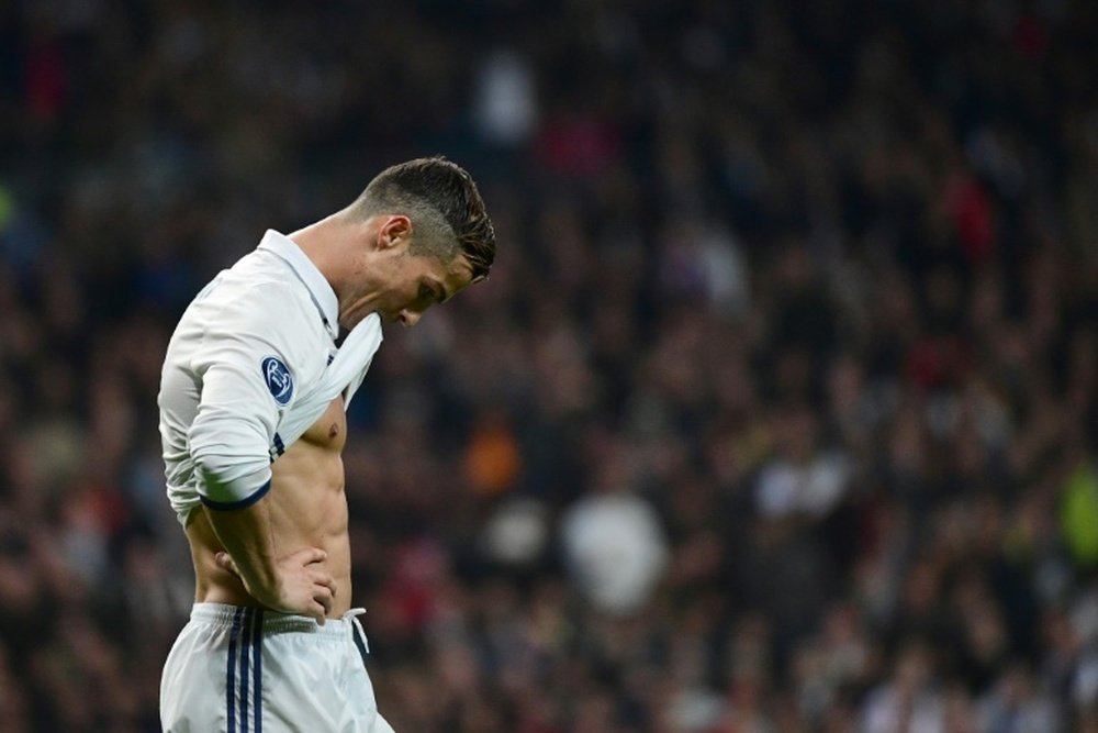 Real Madrid's forward Cristiano Ronaldo gestures during the UEFA Champions League football match Real Madrid CF vs Borussia Dortmund on December 7, 2016