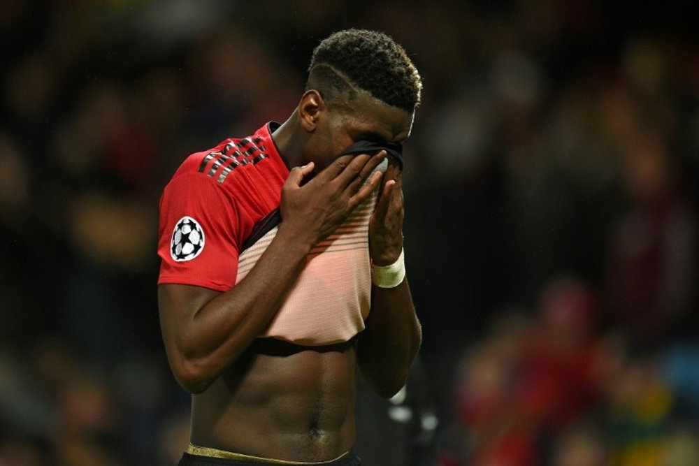 Paul Pogba looks dejects as United miss the chance to finish top. AFP