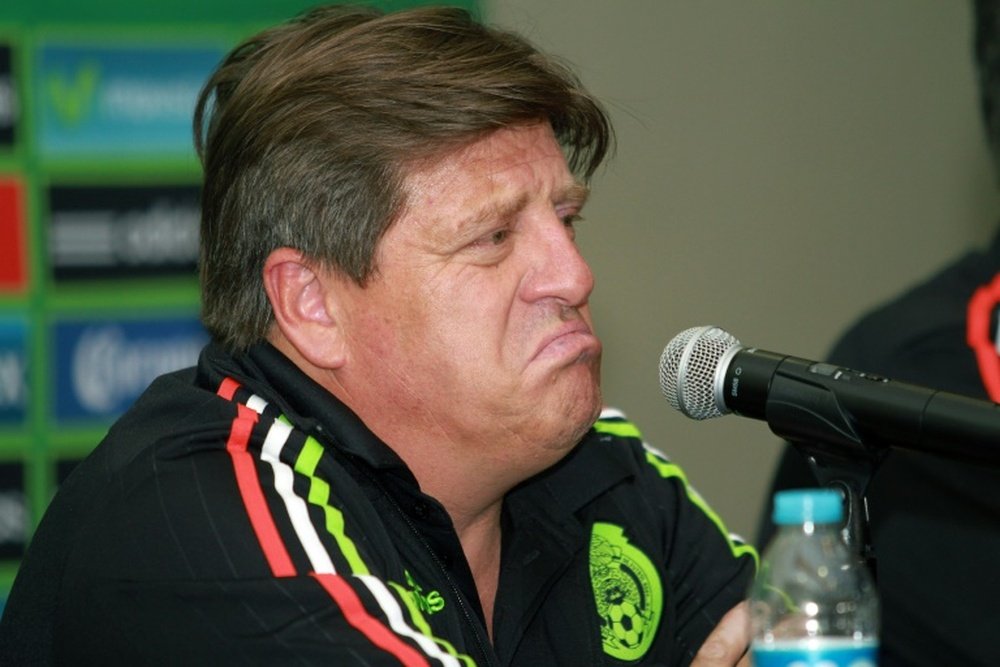 Miguel Herrera speaks during a press conference after his arrival in Mexico on June 20, 2015, in Mexico city