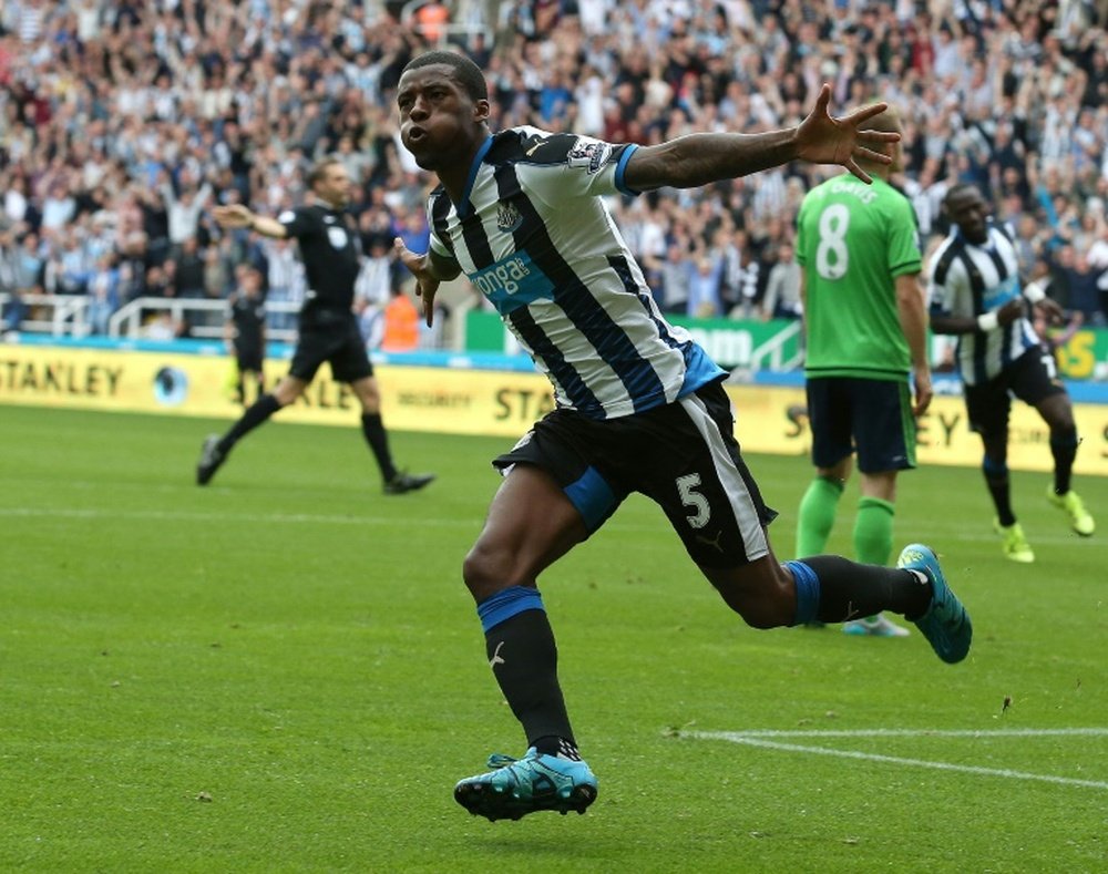 Newcastle Uniteds midfielder Georginio Wijnaldum celebrates scoring their second goal during an English Premier League football match against Southampton at St James Park in Newcastle-upon-Tyne, north east England, on August 9, 2015