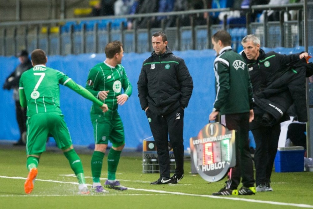 Celtic manager Ronny Deila (C) says his only focus is on winning a league and cup double with the Hoops as speculation continues to grow about his future