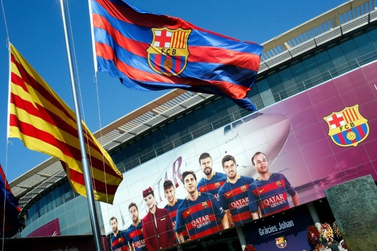 FC Barcelona and Catalan flags fly in Barcelona on March 26, 2016