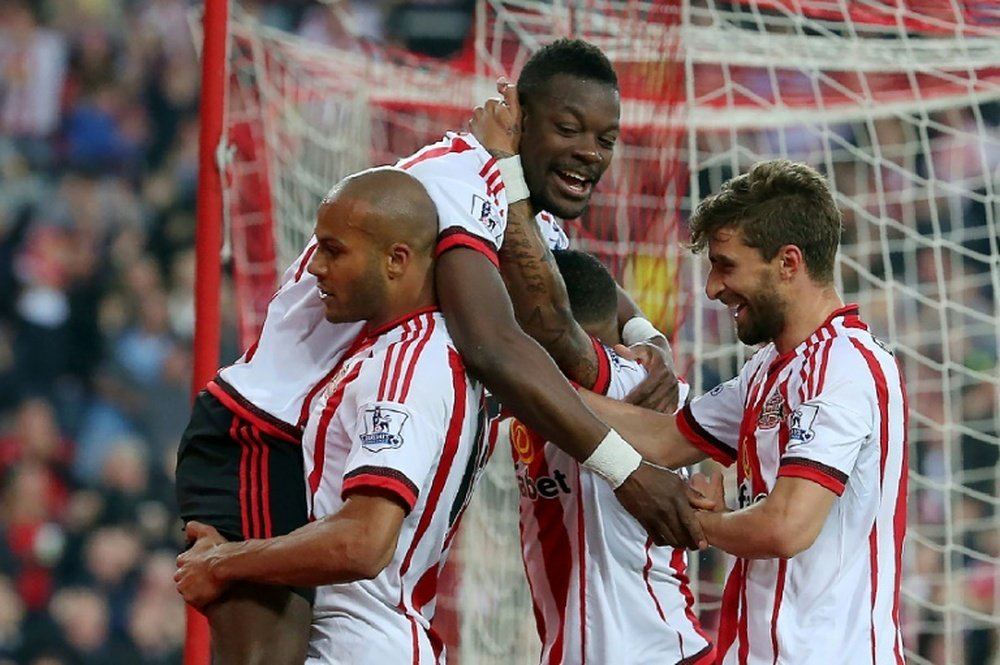 Sunderlands defender Lamine Kone (top) celebrates after scoring his teams third goal on May 11, 2016