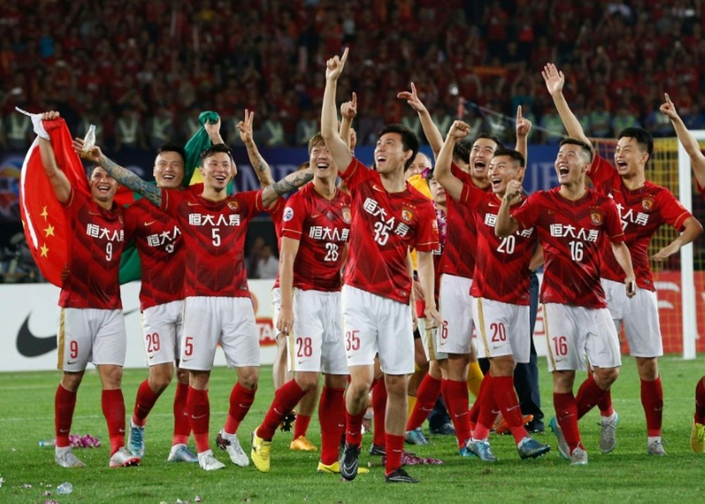 Chinas Guangzhou Evergrande players celebrate their win in the AFC Champions League final against UAEs Al Ahli, in Guangzhou, on November 21, 2015