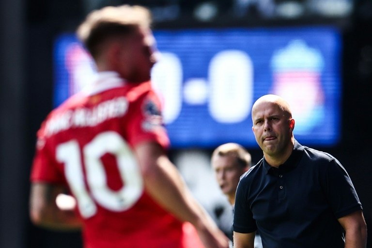 Liverpool manager Arne Slot (R) won his first game in charge 2-0 at Ipswich. AFP