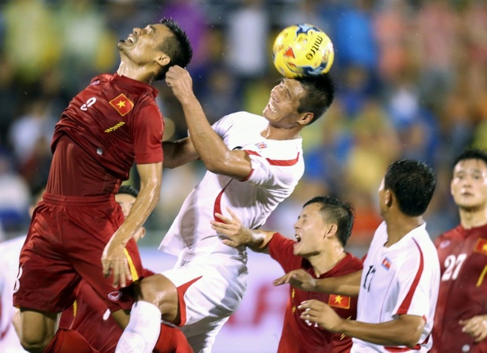Nguyen Trong Hoang (left) plays for Vietnam against North Korea in Ho Chi Minh City last month