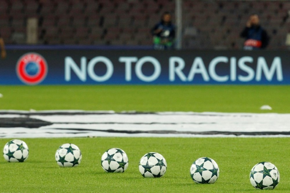 Players should walk off if they hear racist abuse, says the Labour leader. AFP