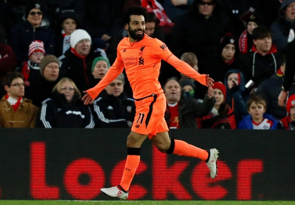 Salah e Firmino assinaram os gols. AFP