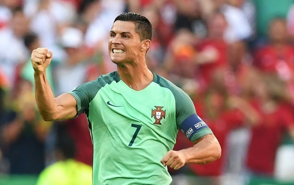 Portugals forward Cristiano Ronaldo celebrates after scoring a goal during the Euro 2016 match between Hungary and Portugal on June 22, 2016