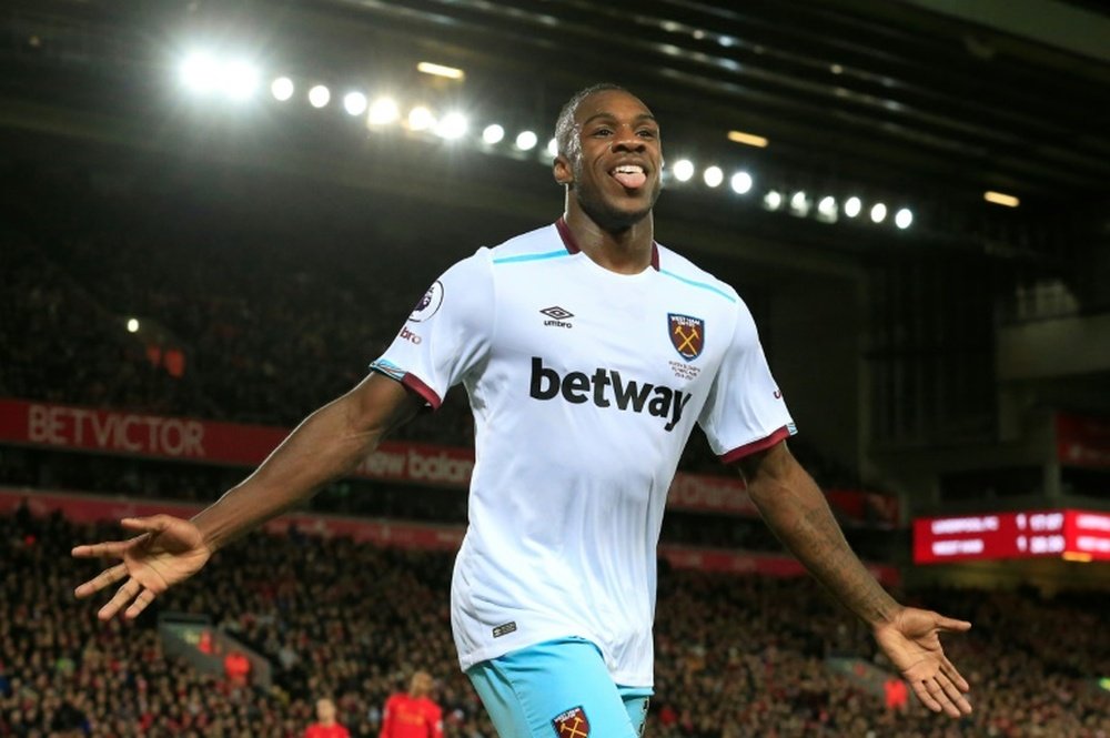 Antonio celebrates scoring against Liverpool at Anfield. AFP