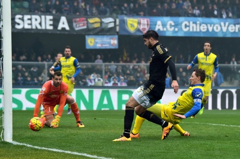Juventus Alvaro Morata (in black) scores during the Serie A match against Chievo at the Bentegodi Stadium in Verona, on January 31, 2016