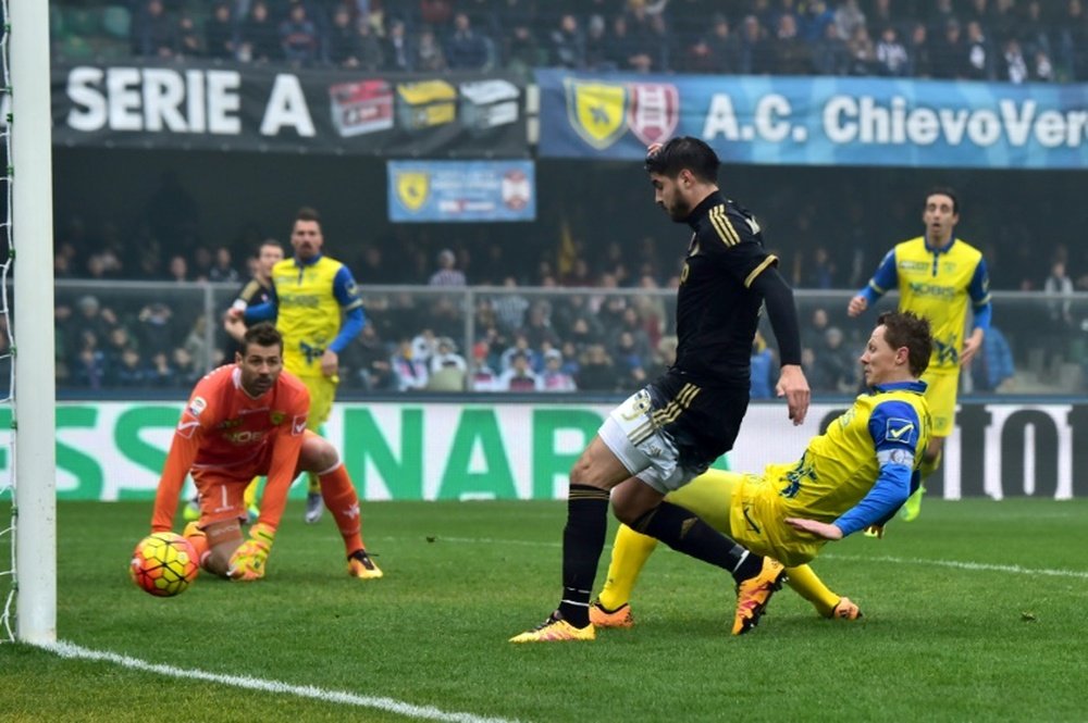 Juventus Alvaro Morata (in black) scores during the Serie A match against Chievo at the Bentegodi Stadium in Verona, on January 31, 2016