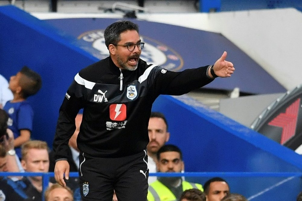 Huddersfield's 1-1 draw at Stamford Bridge secured their survival last season. AFP
