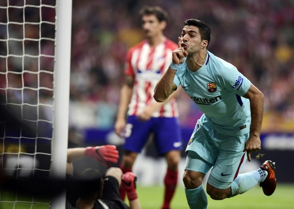 Hoy se cumplen tres años del debut de Suárez con la camiseta del Barça. AFP