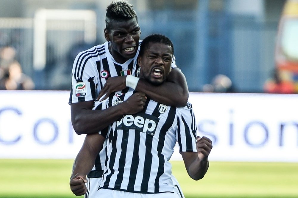 Juventus defender Patrice Evra (C) celebrates with teammate Paul Pogba after scoring during an Italian Serie A football match against Empoli on November 8, 2015 at the Carlo Castellani comunal stadium in Empoli