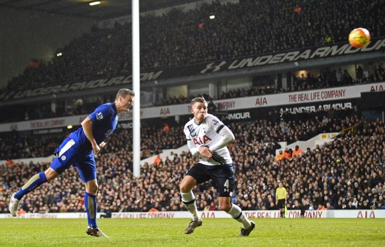 Leicester Citys defender Robert Huth (L) scores the only goal past Tottenham Hotspurs defender Toby Alderweireld on January 13, 2016