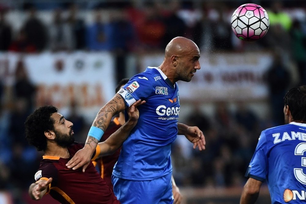 Empolis forward Massimo Maccarone (R) vies with Romas midfielder Mohamed Salah during the Italian Serie A football match October 17, 2015