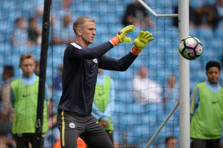 Hart warms up ahead of Manchester City's opening game of the season. AFP