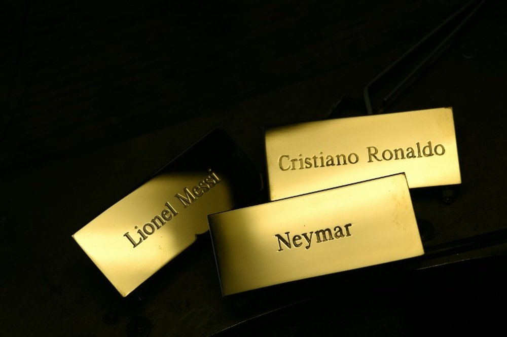 Three plaques reading, Cristiano Ronaldo, Lionel Messi and Neymar at the Mellerio jewellers in Paris, as part of the crafting of the Ballon dOr 2015 Fifa award