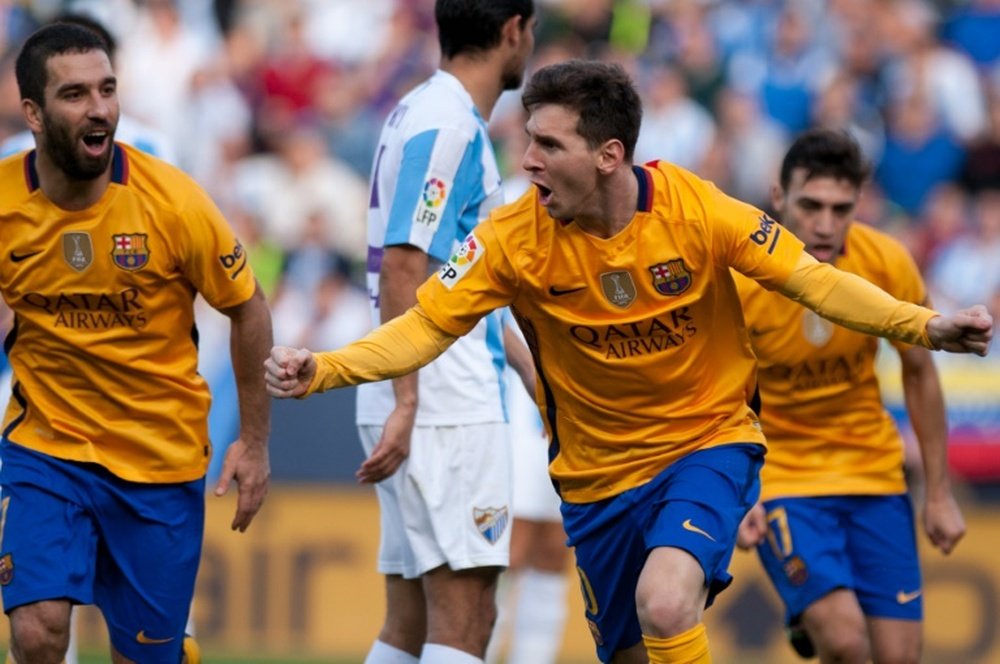 Barcelonas forward Lionel Messi celebrates after scoring during the Spanish league football match against Malaga at La Rosaleda stadium on January 23, 2016