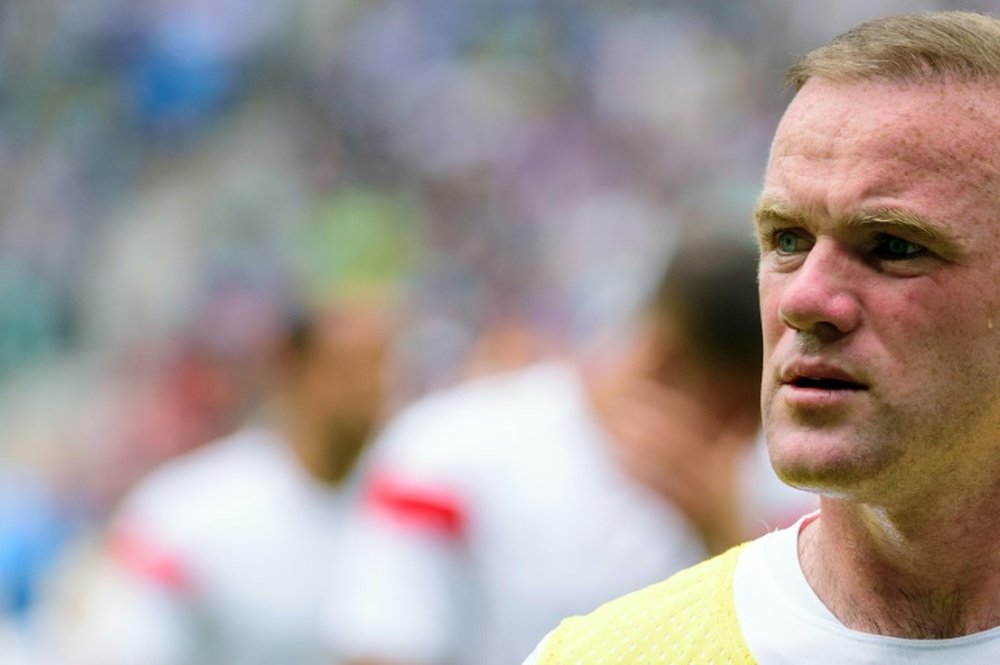 Englands Wayne Rooney walks onto the pitch for their Euro 2016 qualifying football match against Slovenia in Ljubljana, on June 14, 2015